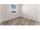 Simple bedroom with wood-look floors and window coverings at 555 Meadow Pointe Dr, Haines City, FL 33844