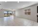 Living room with tile floors, sliding glass doors, and a ceiling fan at 555 Meadow Pointe Dr, Haines City, FL 33844