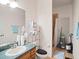 Bathroom featuring a sink with a green countertop, a toilet, and a shower with a curtain at 18744 Sabal St, Orlando, FL 32833