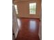 Bright bedroom with hardwood floors and windows offering natural light at 18744 Sabal St, Orlando, FL 32833