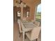 Bright dining room with a glass-topped table and views to the backyard at 18744 Sabal St, Orlando, FL 32833