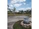 Home exterior with well-maintained lawn, mature trees, and a decorative fountain at 18744 Sabal St, Orlando, FL 32833