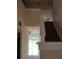 Open hallway featuring tile floors and stairs, creating a seamless flow throughout the home at 18744 Sabal St, Orlando, FL 32833