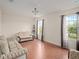 Bright living room with hardwood floors, neutral paint, and two sofas at 18744 Sabal St, Orlando, FL 32833