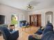 Cozy living room with tile floors, a ceiling fan, and a view of the backyard through sliding glass doors at 18744 Sabal St, Orlando, FL 32833