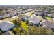 Aerial view showcasing home and surrounding neighborhood at 25304 Forest Oak Ct, Leesburg, FL 34748