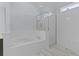 Spa-like bathroom with soaking tub and walk-in shower at 25304 Forest Oak Ct, Leesburg, FL 34748