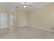 Simple bedroom with tile flooring and neutral wall colors at 25304 Forest Oak Ct, Leesburg, FL 34748
