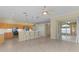 Open kitchen with island seating and stainless steel appliances at 25304 Forest Oak Ct, Leesburg, FL 34748