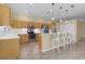 Modern kitchen with stainless steel appliances and breakfast bar at 25304 Forest Oak Ct, Leesburg, FL 34748