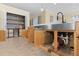 Well-equipped kitchen with pull-out shelving and pantry at 25304 Forest Oak Ct, Leesburg, FL 34748