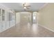 Bright living room featuring tile floors and built-in shelving at 25304 Forest Oak Ct, Leesburg, FL 34748