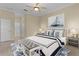 Spacious main bedroom with king-size bed and en-suite bathroom access at 25304 Forest Oak Ct, Leesburg, FL 34748
