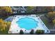 Community pool with plenty of lounge chairs and umbrellas at 25304 Forest Oak Ct, Leesburg, FL 34748