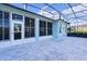Spacious screened patio with paver stones and view of the backyard at 25304 Forest Oak Ct, Leesburg, FL 34748