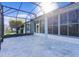 Bright screened patio with paver stones and backyard access at 25304 Forest Oak Ct, Leesburg, FL 34748