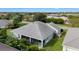 House with a screened porch, located in a quiet residential neighborhood at 768 Bradford Loop, The Villages, FL 32163