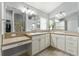 Spa-like bathroom with double vanities and walk-in shower at 768 Bradford Loop, The Villages, FL 32163