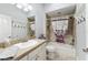 Bathroom with tub, shower, and granite countertop at 768 Bradford Loop, The Villages, FL 32163