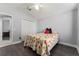 Bedroom with large window, and floral bedding at 768 Bradford Loop, The Villages, FL 32163