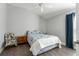Bedroom with chair, nightstand and ceiling fan at 768 Bradford Loop, The Villages, FL 32163