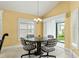 Charming breakfast nook with sliders leading to the backyard at 768 Bradford Loop, The Villages, FL 32163