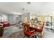Open dining room with view into kitchen and living room areas at 768 Bradford Loop, The Villages, FL 32163