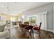 Dining area with sliding doors leading to backyard, near kitchen at 768 Bradford Loop, The Villages, FL 32163