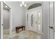 Entryway with tile floors, bench, and access to other rooms at 768 Bradford Loop, The Villages, FL 32163