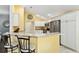 Modern kitchen with stainless steel appliances and white cabinets at 768 Bradford Loop, The Villages, FL 32163