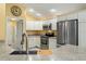 Kitchen with stainless steel appliances and granite countertops at 768 Bradford Loop, The Villages, FL 32163