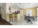 Kitchen features stainless steel appliances and breakfast bar at 768 Bradford Loop, The Villages, FL 32163