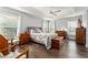 Spacious main bedroom with hardwood floors and ample natural light at 768 Bradford Loop, The Villages, FL 32163