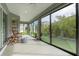 Relaxing sunroom featuring hardwood floors, sliding glass doors and ceiling fan at 768 Bradford Loop, The Villages, FL 32163