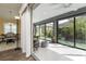 Bright sunroom with sliding glass doors, hardwood floors, and comfortable seating at 768 Bradford Loop, The Villages, FL 32163