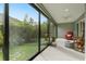 Spacious sunroom with sliding glass doors, comfortable seating and backyard view at 768 Bradford Loop, The Villages, FL 32163