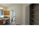 Bathroom showcasing wood cabinetry, linen closet and a separate toilet room at 17755 Se 85Th Ellerbe Ave, The Villages, FL 32162