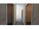 Hallway showcasing access to two walk-in closets with wire shelving at 17755 Se 85Th Ellerbe Ave, The Villages, FL 32162