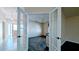 View through French doors to living area and bright entry way with tile floors at 17755 Se 85Th Ellerbe Ave, The Villages, FL 32162
