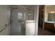 Bathroom featuring glass shower with tiled walls and a peek into the vanity area at 17755 Se 85Th Ellerbe Ave, The Villages, FL 32162