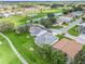 Aerial view of house and golf course community at 32857 Timberwood Dr, Leesburg, FL 34748