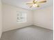 Bright bedroom with ceiling fan and carpet at 32857 Timberwood Dr, Leesburg, FL 34748