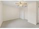 Spacious bedroom with ceiling fan and closet at 32857 Timberwood Dr, Leesburg, FL 34748