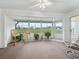 Sunroom with golf course view and seating at 32857 Timberwood Dr, Leesburg, FL 34748
