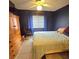Bedroom with double bed, dresser, and window at 6116 Curry Ford Rd # 229, Orlando, FL 32822