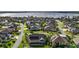 Residential neighborhood with lush landscaping and picturesque lake views at 4049 Nostalgia Ter, The Villages, FL 32163