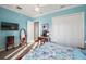 Bright bedroom with blue walls, carpeting, and a closet at 4049 Nostalgia Ter, The Villages, FL 32163