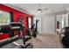 Home gym with exercise equipment including a treadmill, elliptical and a weight machine at 4049 Nostalgia Ter, The Villages, FL 32163