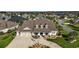 Charming single-Gathering home with a three-car garage, manicured lawn, and an inviting front porch at 4049 Nostalgia Ter, The Villages, FL 32163
