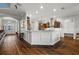 Stylish kitchen with a breakfast bar, modern appliances, granite countertops, and ample cabinet space at 4049 Nostalgia Ter, The Villages, FL 32163